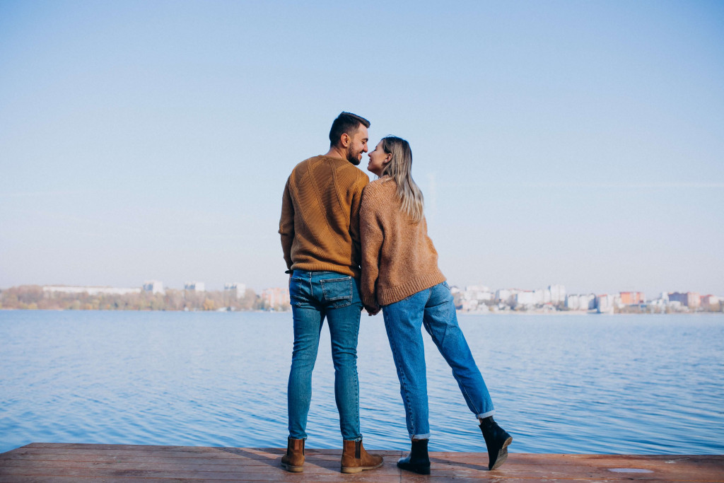 couples standing on the river side