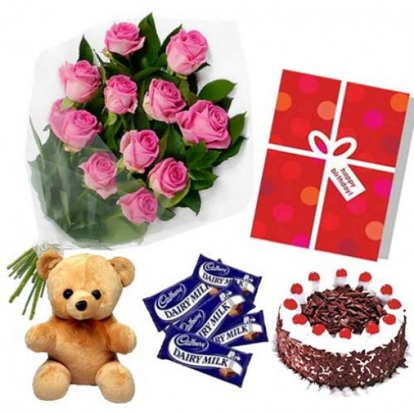 12 Pink Roses with Black Forest Cake (Half kg), Greeting Card, Teddy Bear (6inches) and 5 DairyMilk Chocolates (13.2 gm)