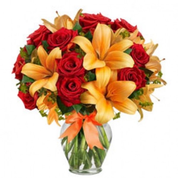 15 Red Roses and 4 Yellow Asiatic Lilies in a Glass Vase