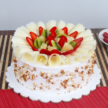 Half Kg Pineapple Fruit Cake Topped with Fresh Fruits and White Chocolates