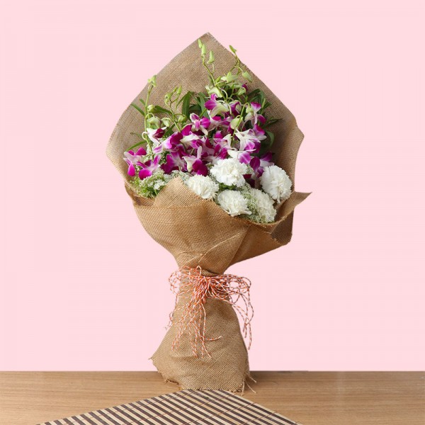 6 Purple orchids and 5 White Carnations in Jute Packing