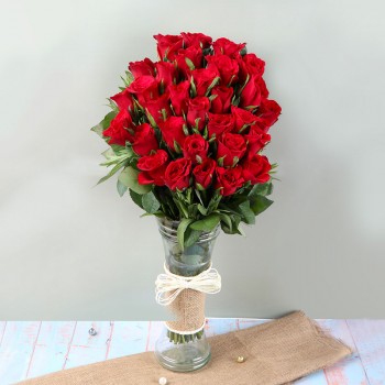  An arrangement of 30 Red Roses in a Glass Vase