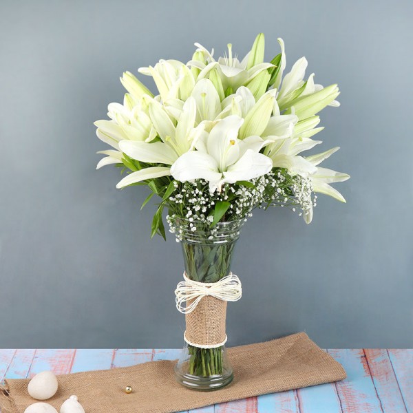 6 White Asiatic Lilies in a Glass Vase wrapped with jute