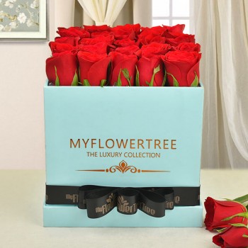 30 red roses in blue box tied with black ribbon