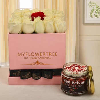  29 white roses and 1 red rose in middle in pink box with black ribbon tied on it with Red Velvet cake in a jar