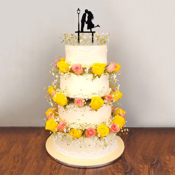 7 Kg 4 Tier Vanilla Cake decorated with 50 (pink and yellow roses) with Couple Silhoutte