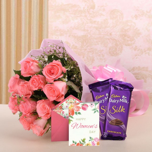 12 Pink Roses in Pink Paper with 2 Cadbury's Silk (60gms each) and 1 Greeting Card for womens day