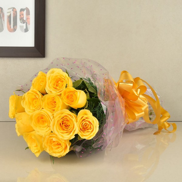 12 Yellow Roses wrapped in cellophane