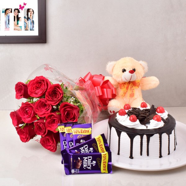 12 Red Roses with 5 Cadbury's DairyMilk Chocolates (13.2 gm) and Half Kg Black Forest Cake and Teddy Bear (6inches)