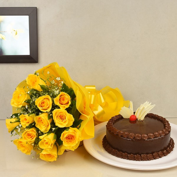 12 Yellow Roses wrapped in yellow paper packing with Half Kg Chocolate Cake