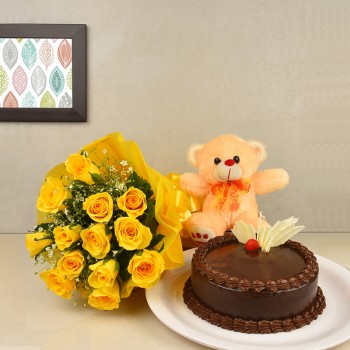 12 Yellow Roses in Paper packing with Half Kg Chocolate Cake and Teddy Bear (6 inch)