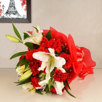 12 Red Carnations and 4 White Asiatic Lilies in Paper packing
