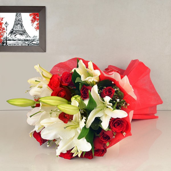 12 Red Roses and 4 White Asiatic Lilies in Paper packing