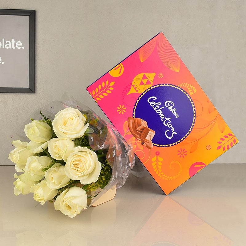 10 white roses in cellophane with One Celebration Box( 125.2 gms)