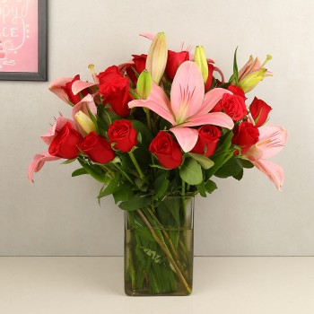 4 Asiatic Pink Lilies and 12 Red Roses in a Glass Vase