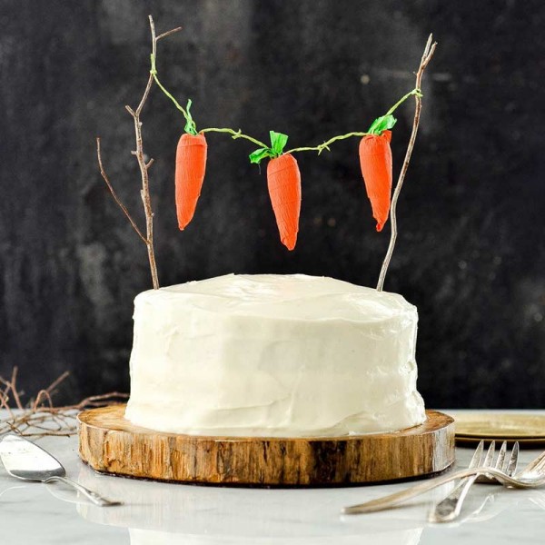 Half Kg Vanilla Cream Cake with Carrot Topped on it