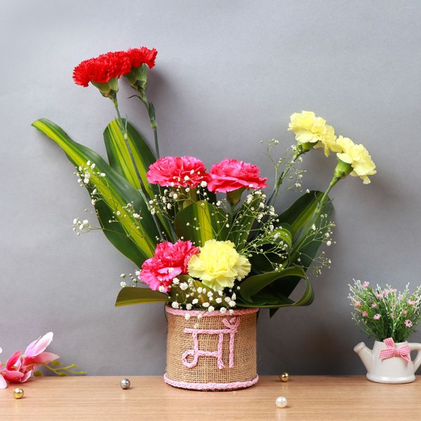 8 Mixed Carnations (Red,Pink,Yellow) in Glass Vase wrapped with jute packing and "Ma" written on it