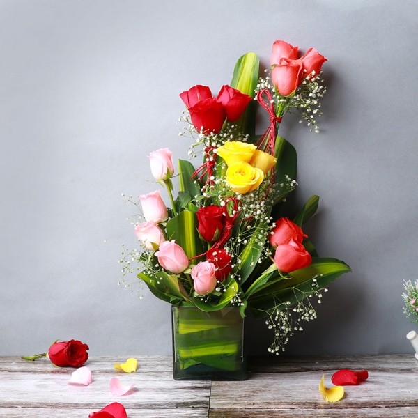 18 Mixed Roses (Red,Light Pink,Yellow,Orange) in Glass Vase with leaves