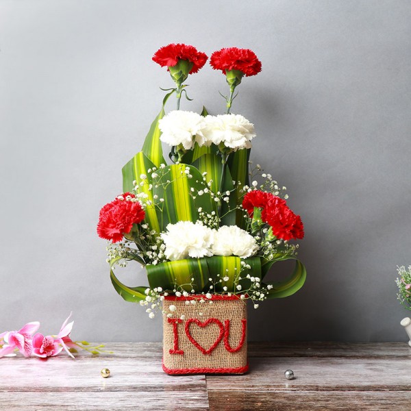 10 Mixed Carnations (Red and White) in Glass Vase wrapped with jute packing and "I Heart U" written on it