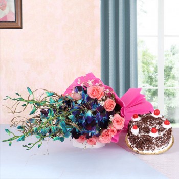 6 Blue Orchids and 12 Pink Roses in Pink Paper packing with Black Forest Cake (Half Kg)