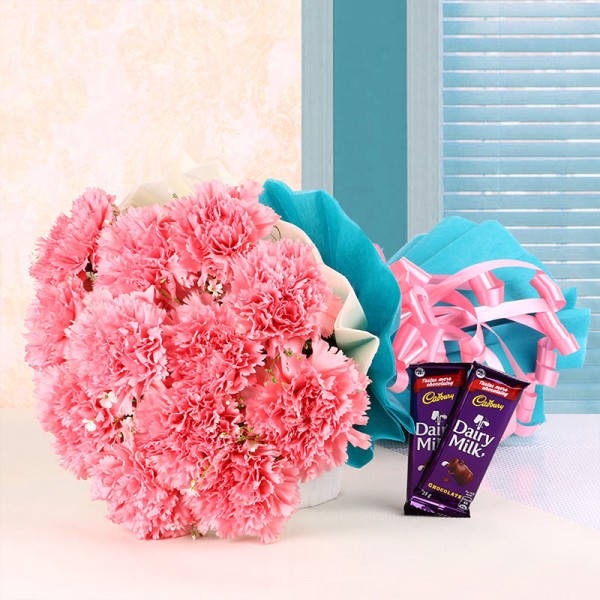 12 Pink Carnations in Blue and White Paper Packing with 2 Cadbury's DairyMilk Chocolates (25gms each)