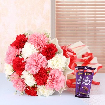 12 Mix Carnations in White Paper packing with 2 Cadbury Dairy Milk Chocolates (25gms each)