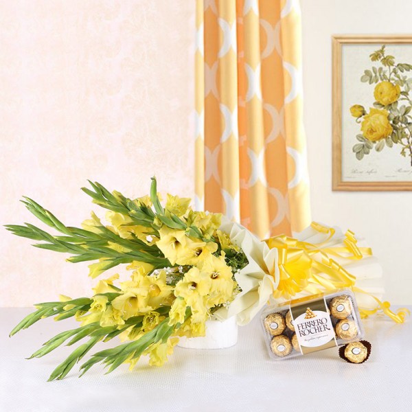 10 Yellow Gladiolus (Glads) in White Packing paper with A Box of 16 Pcs Ferrero Rocher Chocolates