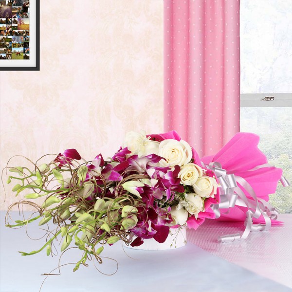 6 Purple Orchids with 12 White Roses in Pink paper packing
