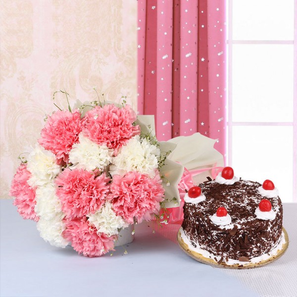 12 Carnations (Pink and White) in White Paper packing with Black Forest Cake (Half Kg)
