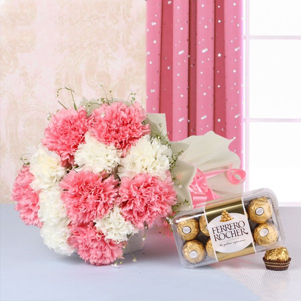 12 Carnations (Pink and White) in White Paper packing with a box of 16 pcs of Ferrero Rocher Chocolates
