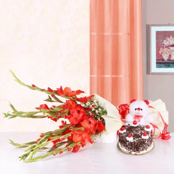 10 Red Glads in White Packing paper with Black Forest Cake (Half Kg) and Teddy Bear (6 inches)