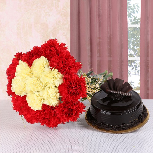 16 Carnations (Yellow and Red) in Yellow Raffia Knot with Chocolate Truffle Cake (Half Kg)