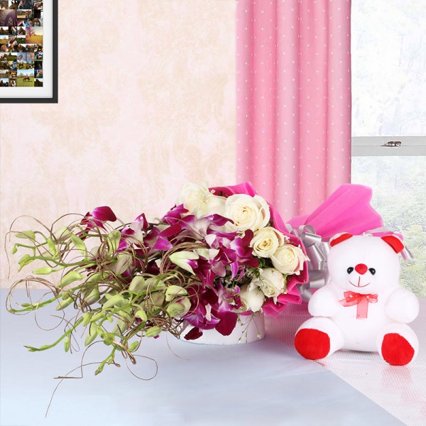  6 Purple Orchids and 12 White Roses in Pink paper packing with Teddy Bear (6 inches)
