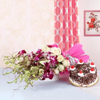 6 Purple Orchids and 12 White Roses in Pink paper packing with Black Forest Cake (Half Kg)