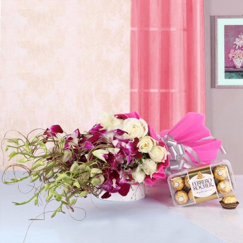 6 Purple Orchids and 12 White Roses in Pink paper packing with a box of 16 pcs of Ferrero Rocher Chocolates