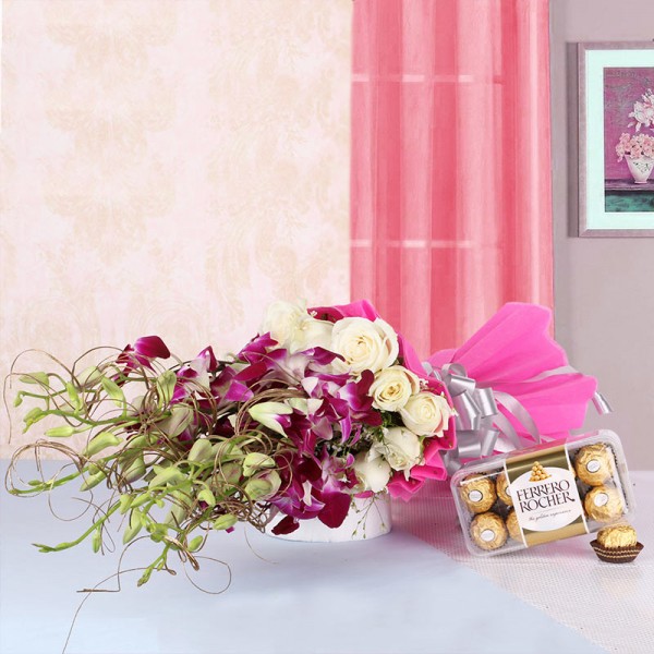 6 Purple Orchids and 12 White Roses in Pink paper packing with a box of 16 pcs of Ferrero Rocher Chocolates