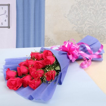 12 Hot Pink Roses in Purple Paper Packing