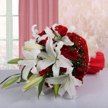 4 White Asiatic Lilies with 15 Red Roses in Paper Packing