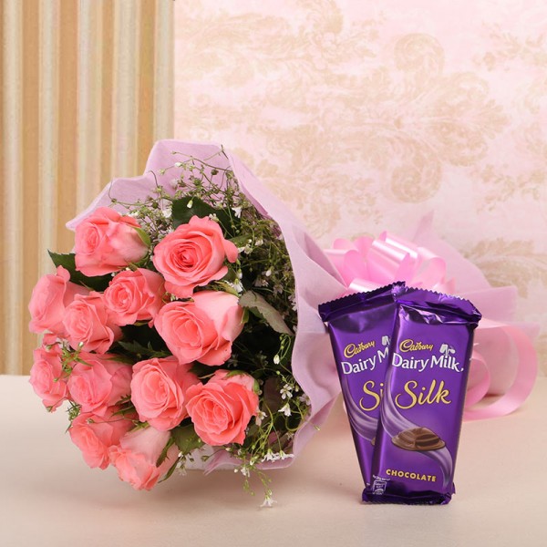 12 Pink Roses in Pink Paper with 2 Cadbury's Silk (60 gms each)