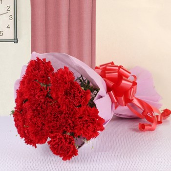 10 Red Carnations in Pink Paper