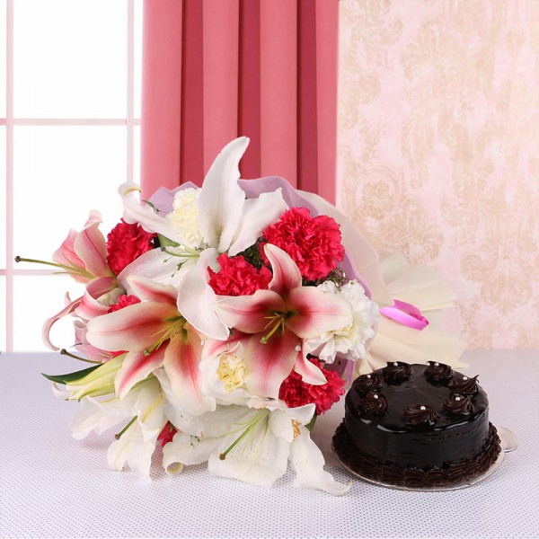 8 Pink and White Carnations and 2 Oriental Pink Lilies - 2 White Asiatic Lilies in Pink and White Paper with Chocolate Truffle Cake (Half Kg)