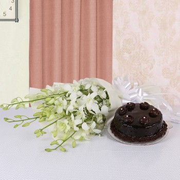  6 White Orchids in White paper with Truffle Cake (Half Kg)