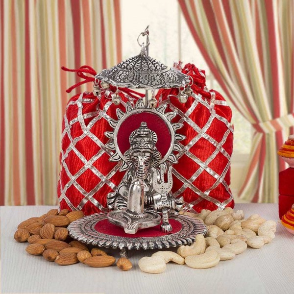 Silver plated Ganesha with Dryfruit Potlis