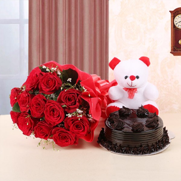 12 Red Roses in Red Paper and Red Bow with Truffle Cake (Half Kg) and 1 Teddy Bear (6inches)