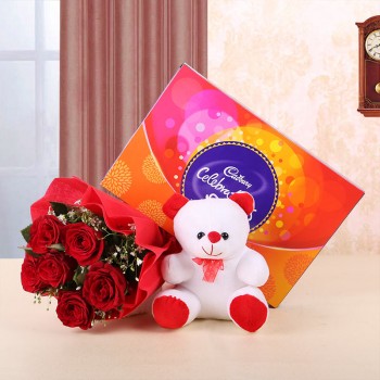 6 Red Roses in Red Paper and Red Bow with Teddy Bear (6 inches) and 1 Cadbury's Celebrations (131.6 gms)