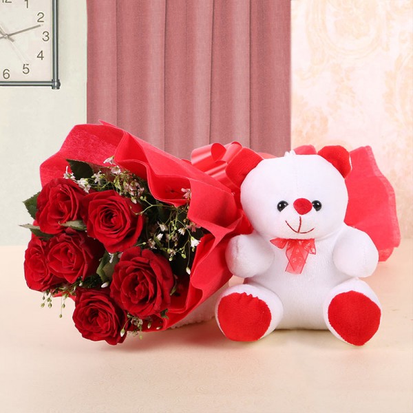  6 Red Roses wrapped in a Red paper and a Red bow with 1 Teddy Bear (6 Inches)