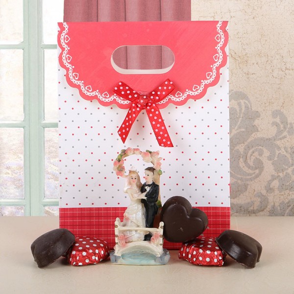 5 Assorted Chocolates with 1 Couple Statue (3 inches) in a Paper Bag