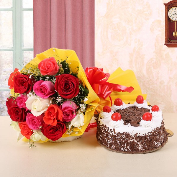 12 Assorted Roses in Yellow Paper and Red Bow with Black Forest Cake (Half Kg)