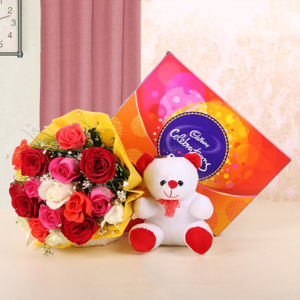12 Assorted Roses in Yellow Paper with 1 Teddy Bear (6 inches) and Cadbury's Celebrations (131.3gms)