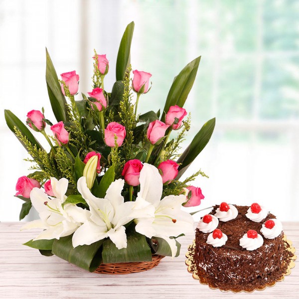 Floral Basket Arrangement with 15 Pink Roses and 2 White Asiatic Lilies and Half Kg Black Forest Cake